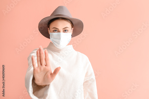 Young woman in medical mask...