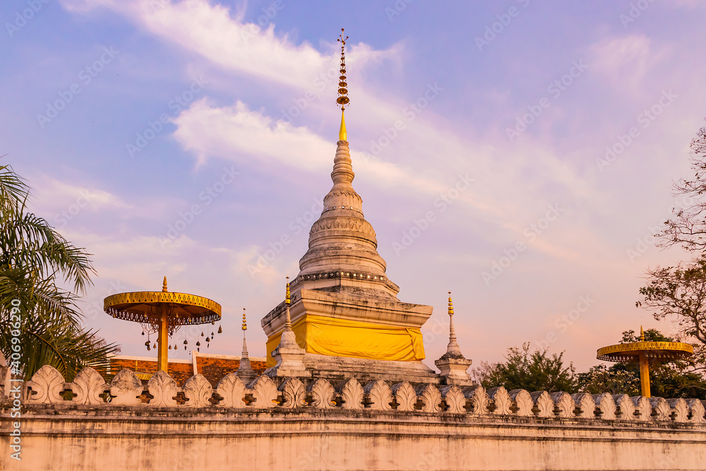 Fototapeta premium White pagoda, Wat Phra That Khao Noi in the evening.