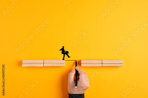 Print op canvas Male hand drawing a bridge line between wooden blocks for a businessman silhouet