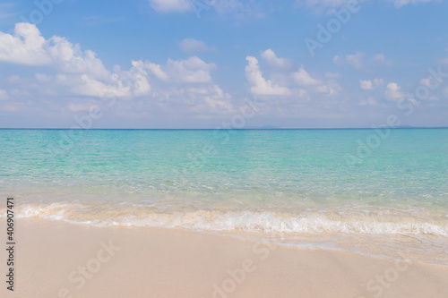 Beautiful beach and tropical sea wave. © Chalearmrat