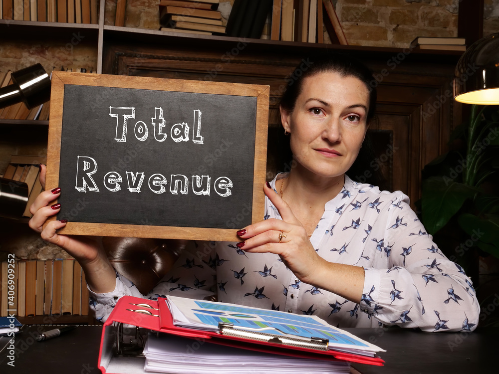Fototapeta premium Business concept meaning Total Revenue with sign on chalkboard.