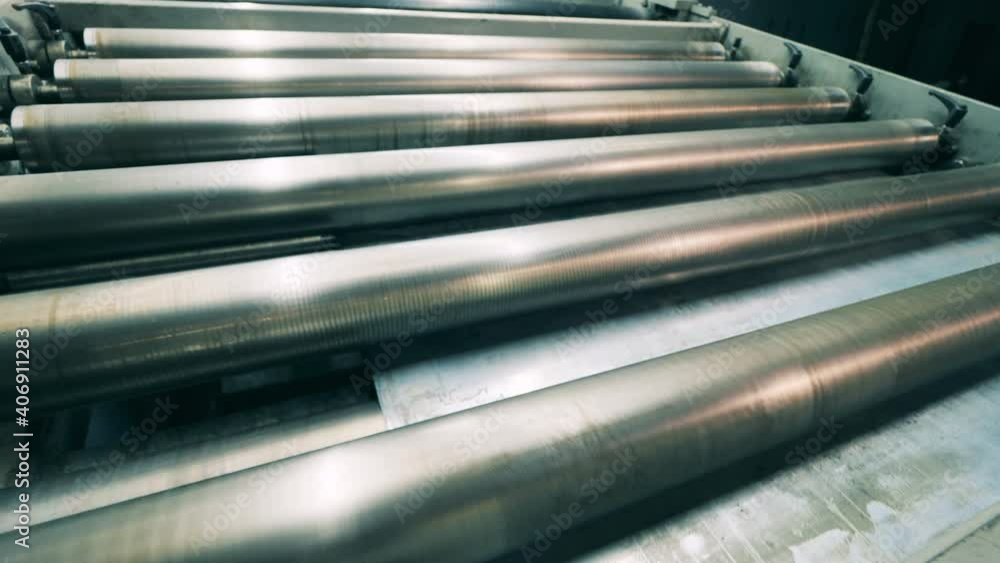 Metal is moving through the conveyor machine Metal is moving through the conveyor machine