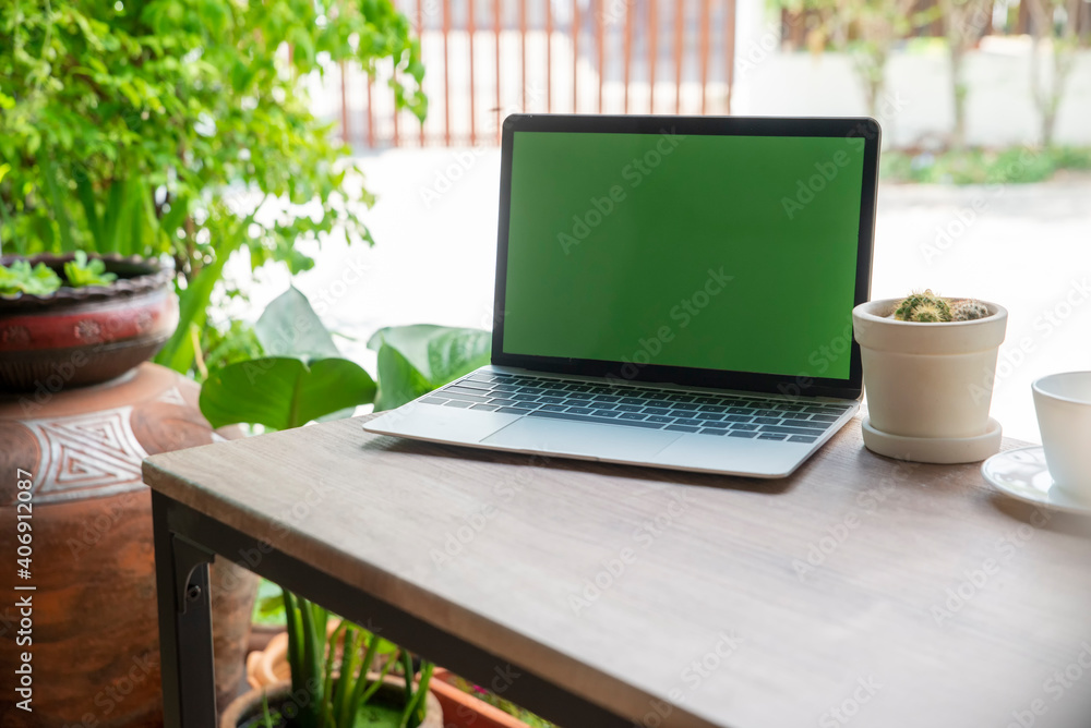 Desktop Laptop, cactus and cup of coffee place on Home Office Desk. Working online at Home Concept. Desktop Laptop, cactus and cup of coffee place on Home Office Desk. Working online at Home Concept.