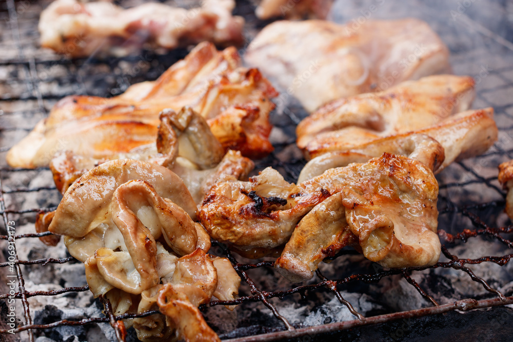 Grilled Pork Intestines and pork ears on the stove Thai style. as delicious food of Thai. Close up photography. Grilled Pork Intestines and pork ears on the stove Thai style. as delicious food of Thai. Close up photography.