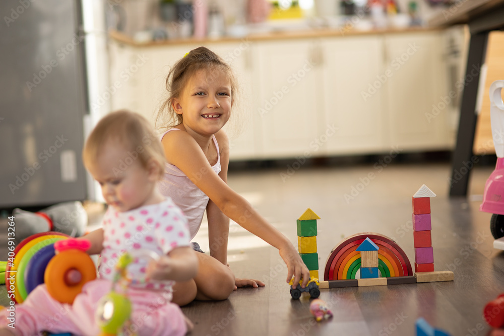 Fototapeta premium Two children play toys
