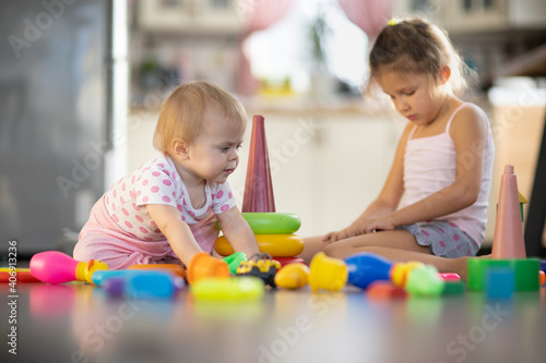 Two children play toys