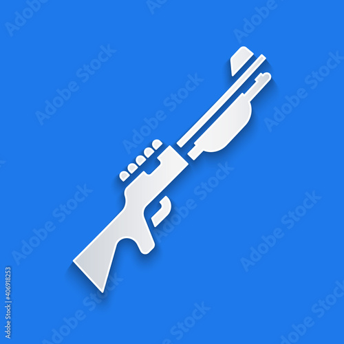 Paper cut Hunting gun icon isolated on blue background. Hunting shotgun. Paper art style. Vector.