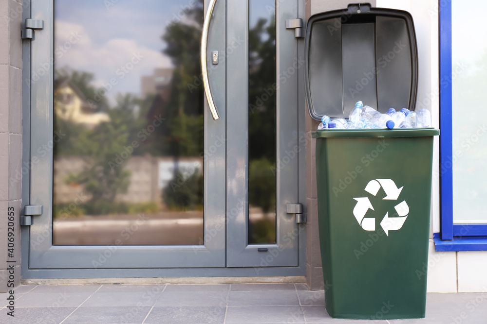 Many used plastic bottles in trash bin outdoors. Recycling problem Many used plastic bottles in trash bin outdoors. Recycling problem