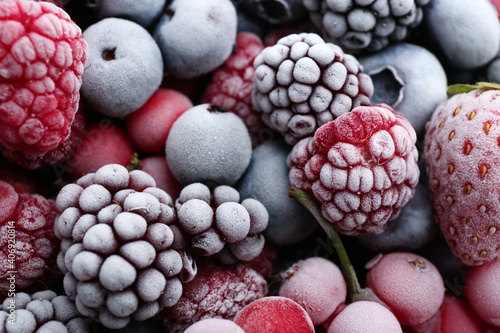 Mix of different frozen berries as background  closeup