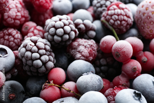 Mix of different frozen berries as background  closeup view