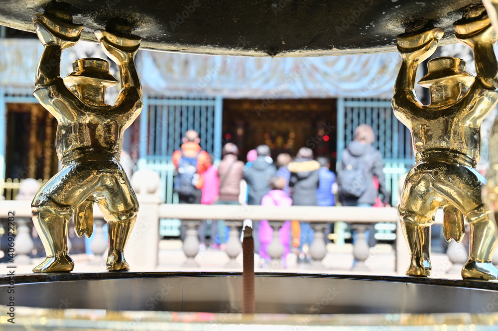 Longshan Temple, Taipei, Taiwan - January 15, 2021: the worshippers hands together to worship the Gods. Longshan Temple, Taipei, Taiwan - January 15, 2021: the worshippers hands together to worship the Gods.