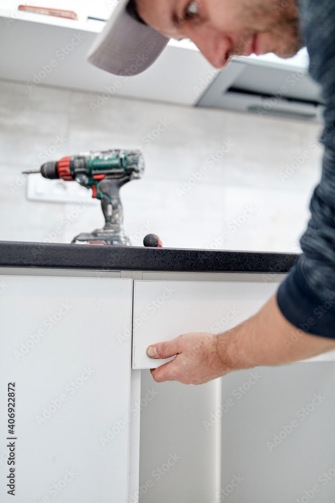 Handyman worker assembling furniture and fixing it. Handyman worker assembling furniture and fixing it.