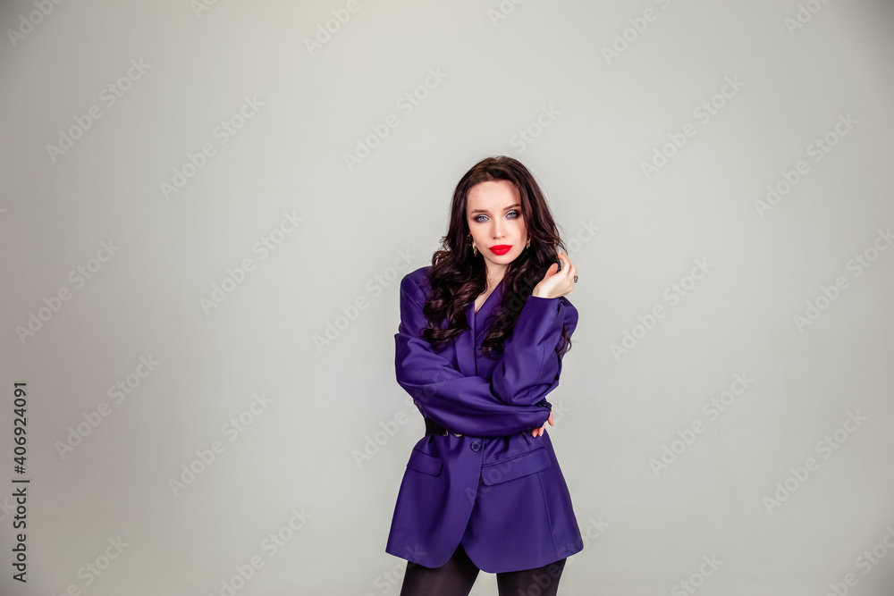beautiful young Russian model girl in retro clothes, she is dressed in a large male purple jacket. beautiful young Russian model girl in retro clothes, she is dressed in a large male purple jacket.