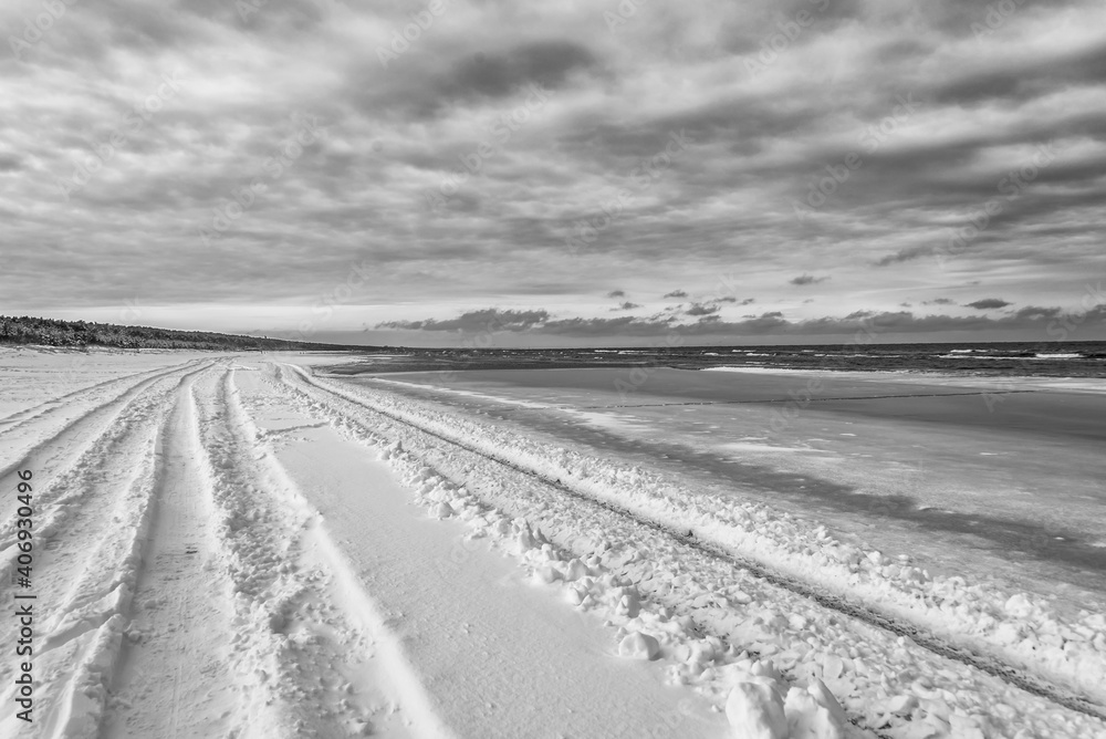 Fototapeta premium Truck Tracks on the Snow on a Baltic Sea Beach in Winter