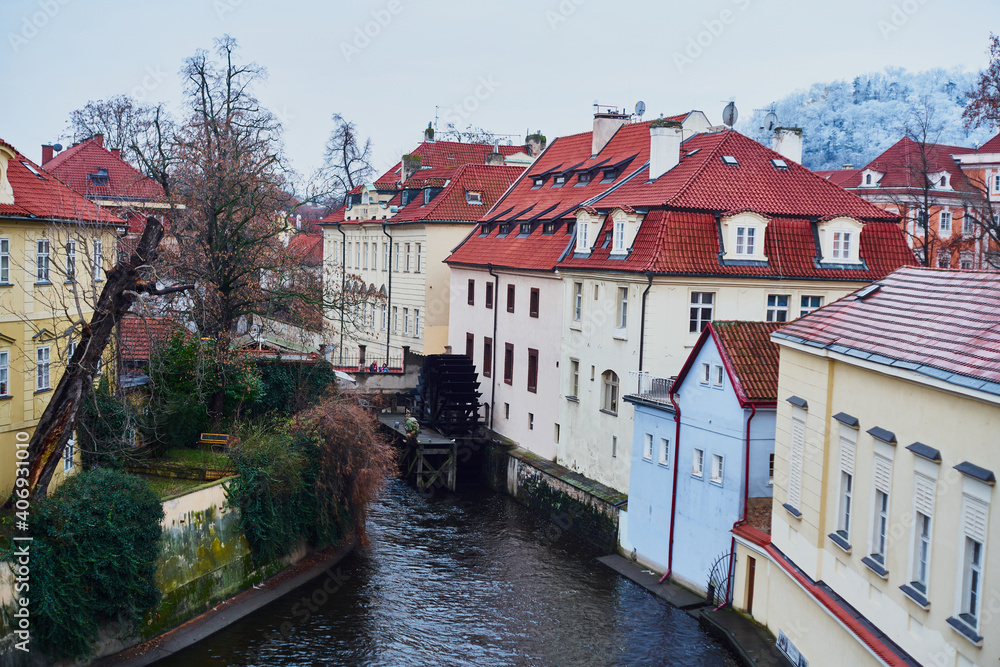 Prague, Czech Republic - January 7 2021: Historical watermill in Certovka, view from the Charles Bridge                                                          