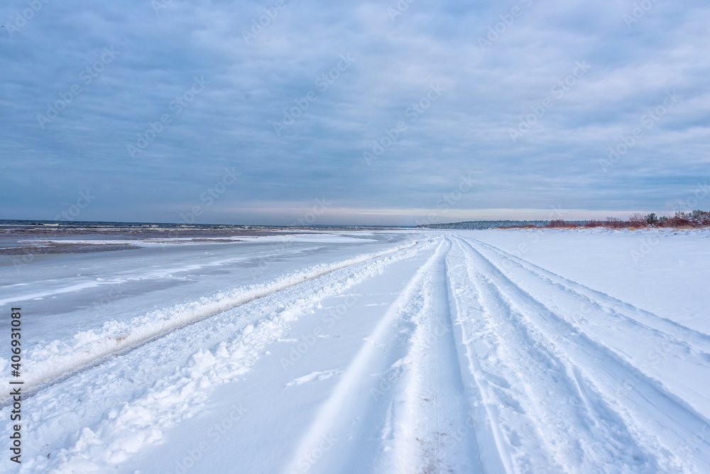 Truck Tracks on the Snow on a Baltic Sea Beach in Winter Truck Tracks on the Snow on a Baltic Sea Beach in Winter