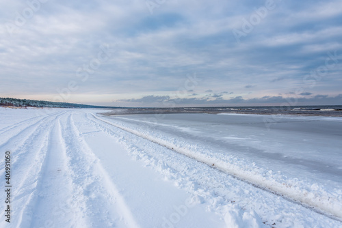 Truck Tracks on the Snow on a Baltic Sea Beach in Winter