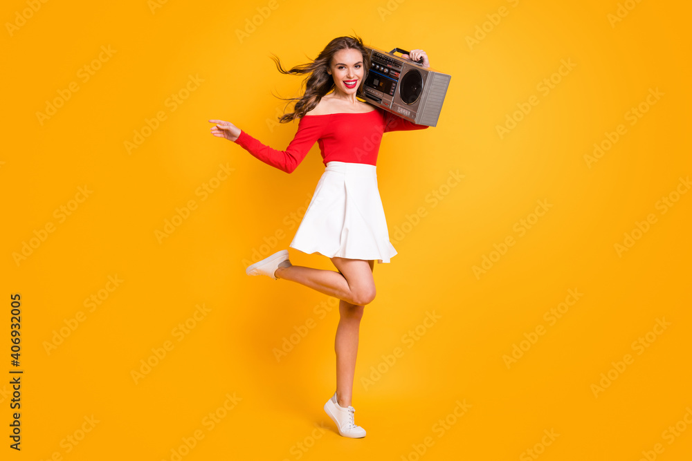 Full length body size photo girl keeping boom-box on shoulder enjoying music party isolated on bright yellow color background - obrazy, fototapety, plakaty 