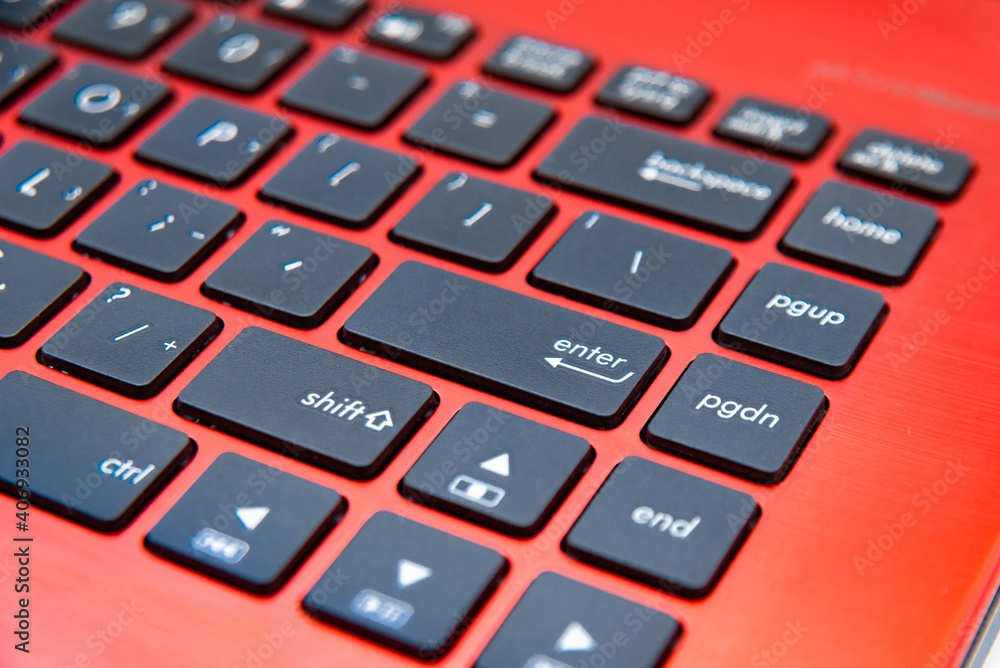 The black keyboard of the red laptop The black keyboard of the red laptop