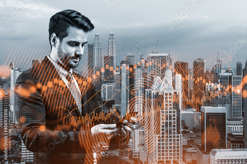 Canvas Print Handsome Caucasian trader checking quotes to forecast the capital market behavior