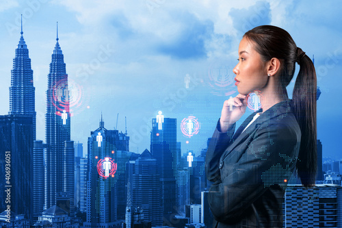 Photography Attractive young Asian HR director at international company is thinking about recruitment of highly qualified specialists