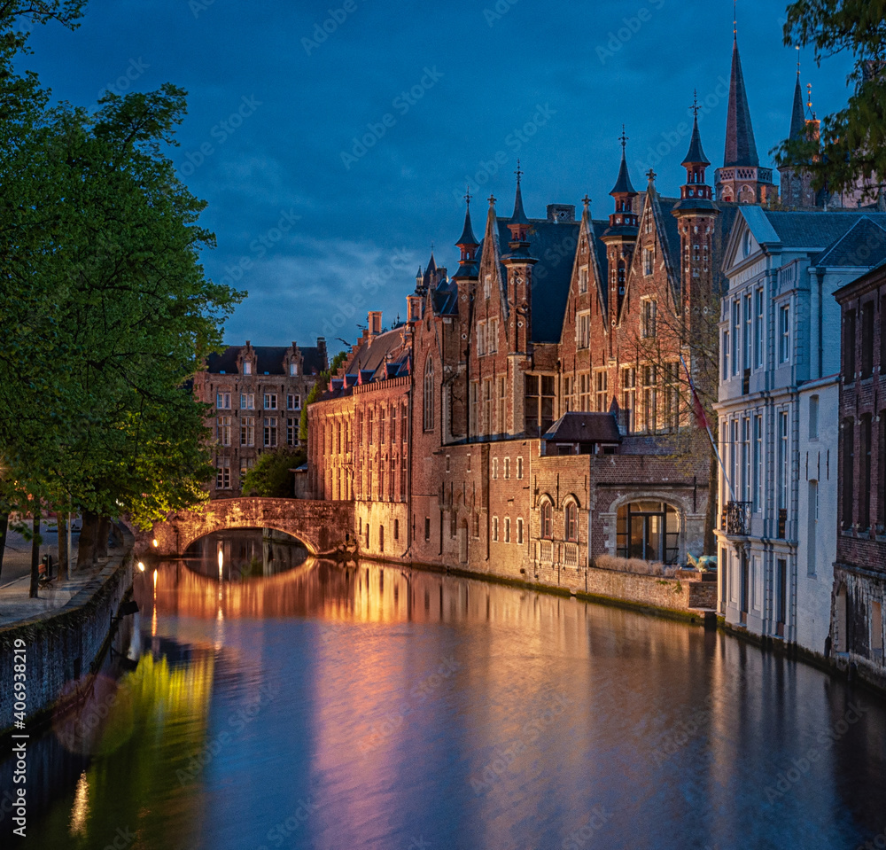 Photo of historic medieval buildings along the canal in Bruges