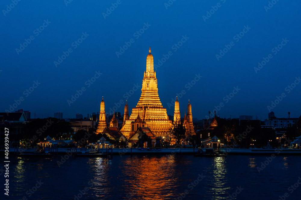 Arun temple Chao Phraya river sunset time with blue sky
