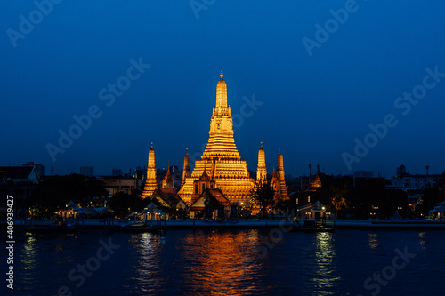 Arun temple Chao Phraya river sunset time with blue sky