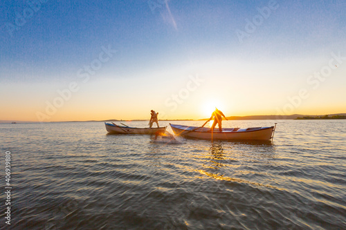 Net fishermen and the sunset / ulubat Lake photo