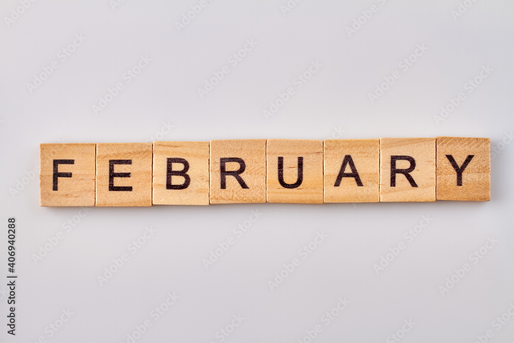 February word written on wood blocks. Isolated on white background. February word written on wood blocks. Isolated on white background.