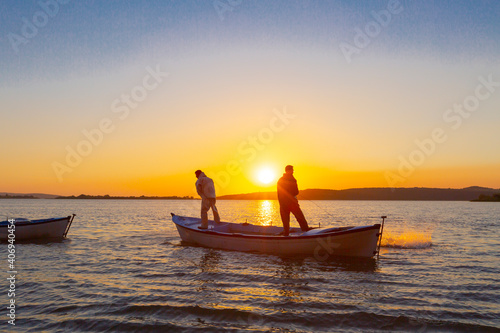 Net fishermen and the sunset / ulubat Lake photo