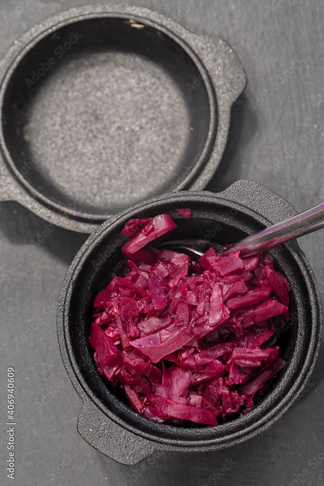 Red Cabbage in a cast iron dish pot. With selective colour Red Cabbage in a cast iron dish pot. With selective colour