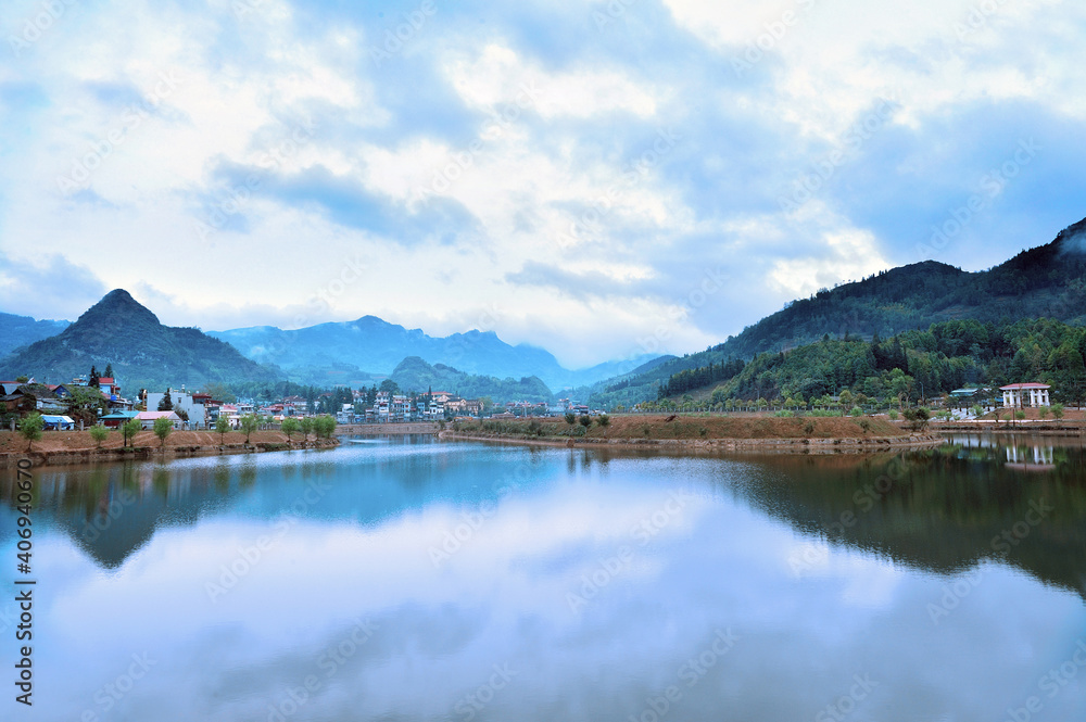 Scenic view of a lake side village in Can Cau, Lao Cai, Vietnam.