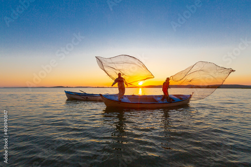 Net fishermen and the sunset / ulubat Lake photo