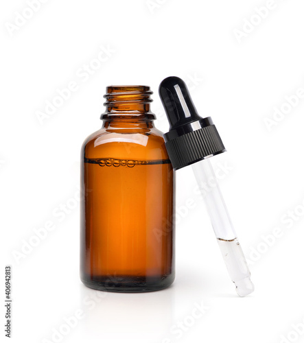 Essential serum oil in amber dropper bottle isolate on white background.