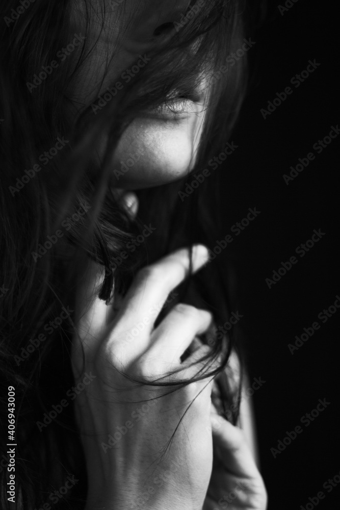 Emotional Sensual black and white portrait of a beautiful girl on a dark background Emotional Sensual black and white portrait of a beautiful girl on a dark background