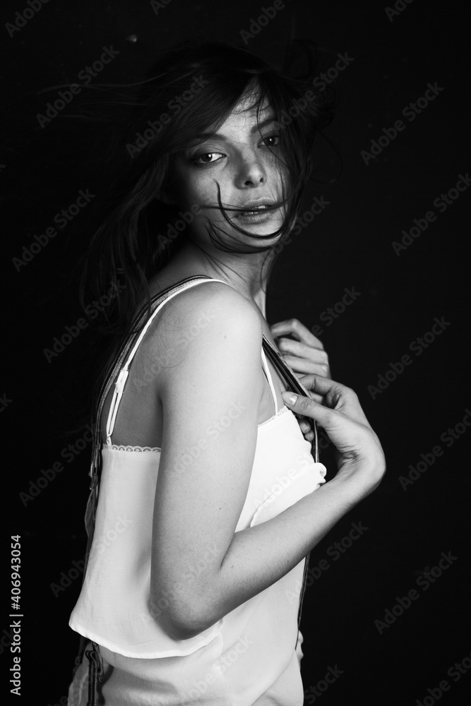 Emotional Sensual black and white portrait of a beautiful girl on a dark background Emotional Sensual black and white portrait of a beautiful girl on a dark background