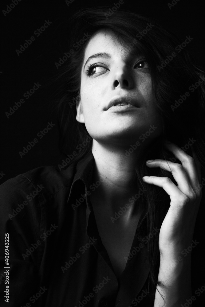 Emotional Sensual black and white portrait of a beautiful girl on a dark background Emotional Sensual black and white portrait of a beautiful girl on a dark background