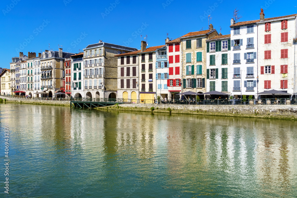 City of Bayonne in France with typical houses and reflection on the Adur River
