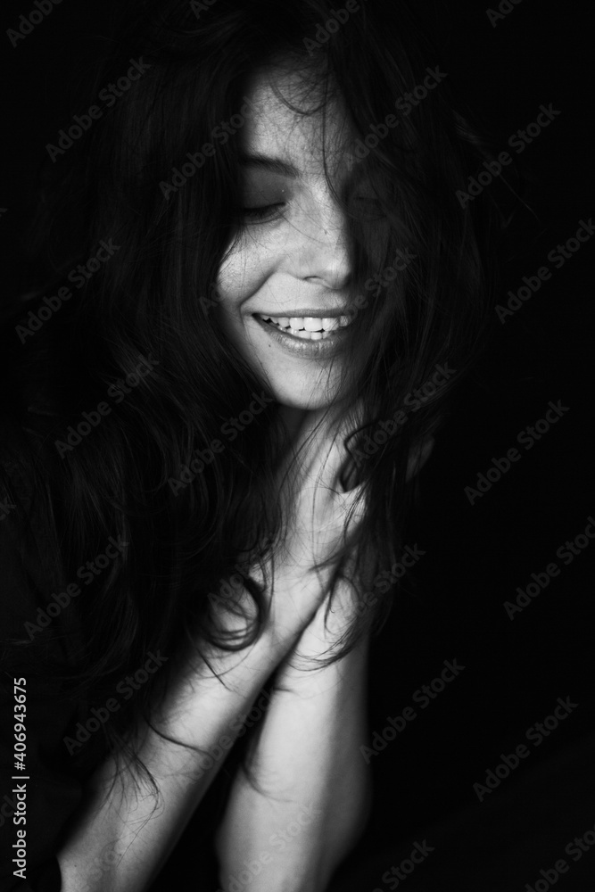 Emotional Sensual black and white portrait of a beautiful girl on a dark background Emotional Sensual black and white portrait of a beautiful girl on a dark background