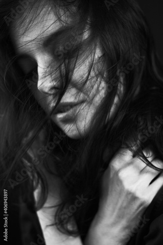 Emotional Sensual black and white portrait of a beautiful girl on a dark background