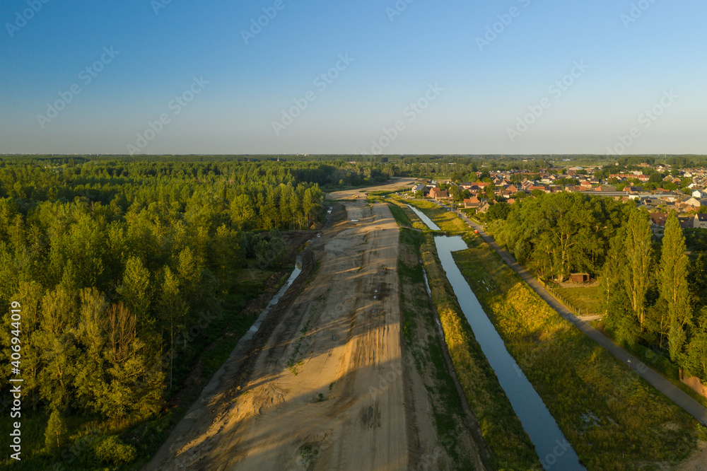 New dyke in the Vlassenbroek polder, part of the Sigma Plan protection measures against flooding from the Scheldt river - Aerial view in Baasrode, Belgium