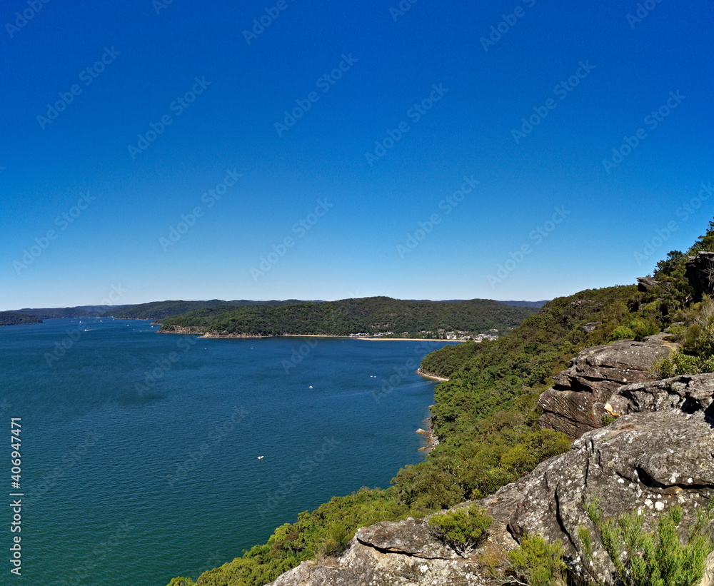 Beautiful view of a deep blue sea, small Lion island, West Head and Barrenjoey Lighthouse, Warrah Lookout, Brisbane Water National Park, New South Wales, Australia
