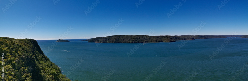 Beautiful panoramic view of a deep blue sea, small Lion island, West Head and Barrenjoey Lighthouse, Warrah Lookout, Brisbane Water National Park, New South Wales, Australia
