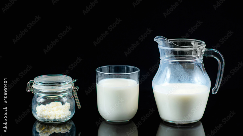Homemade Kefir. Kefir Grains and Kefir in a Jug on a Black Background Homemade Kefir. Kefir Grains and Kefir in a Jug on a Black Background