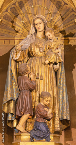 BARCELONA, SPAIN - MARCH 3, 2020: The baroque polychome carved satatue of Madonna in church Basilica de la Merced from 19. cent..