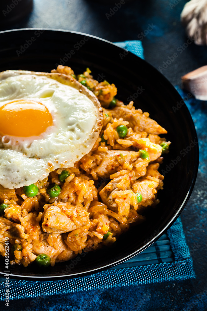 Spicy fried rice with chicken, kimchi and egg