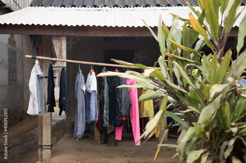 Clothes hanging to dry in traditional Asian village photo