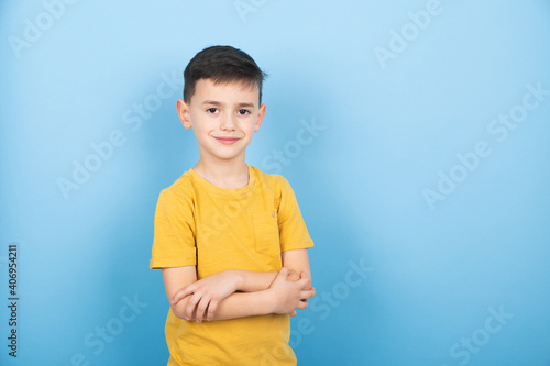child with friendly expression on a blue background