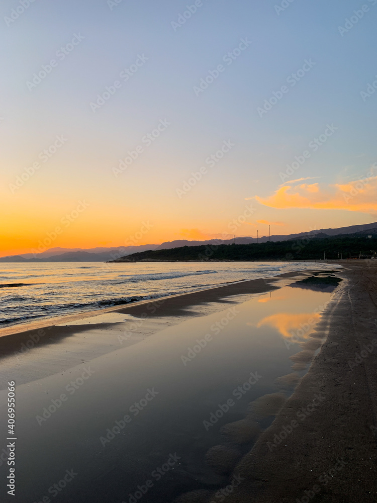 Fototapeta premium Beautiful orange sunset at the sand beach